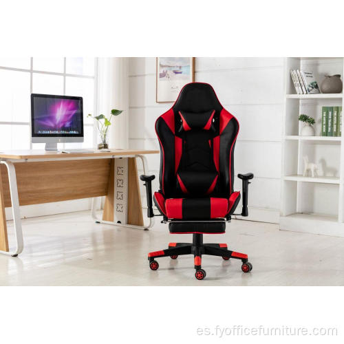 Silla roja para juegos de computadora con reposapiés y respaldo de almohada